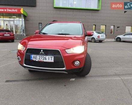 Красный Мицубиси Аутлендер, объемом двигателя 2.36 л и пробегом 93 тыс. км за 11499 $, фото 1 на Automoto.ua