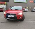 Красный Мицубиси Аутлендер, объемом двигателя 2.36 л и пробегом 93 тыс. км за 11499 $, фото 1 на Automoto.ua