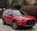 Красный Мицубиси Аутлендер, объемом двигателя 2 л и пробегом 168 тыс. км за 10700 $, фото 1 на Automoto.ua