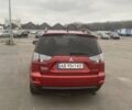 Красный Мицубиси Аутлендер, объемом двигателя 2.36 л и пробегом 210 тыс. км за 11800 $, фото 1 на Automoto.ua