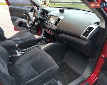 Красный Мицубиси Аутлендер, объемом двигателя 2.36 л и пробегом 93 тыс. км за 11499 $, фото 27 на Automoto.ua