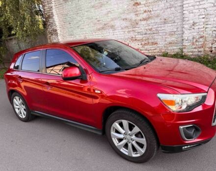 Красный Мицубиси Аутлендер, объемом двигателя 2 л и пробегом 200 тыс. км за 9100 $, фото 1 на Automoto.ua