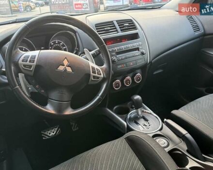 Червоний Міцубісі Аутлендер, об'ємом двигуна 2 л та пробігом 96 тис. км за 10950 $, фото 18 на Automoto.ua