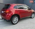 Червоний Міцубісі Аутлендер, об'ємом двигуна 2 л та пробігом 96 тис. км за 10950 $, фото 7 на Automoto.ua