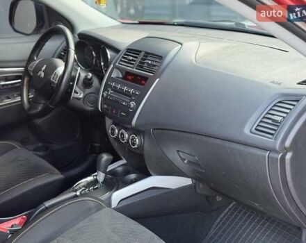 Червоний Міцубісі Аутлендер, об'ємом двигуна 2 л та пробігом 96 тис. км за 10950 $, фото 11 на Automoto.ua