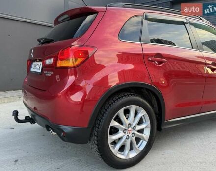 Червоний Міцубісі Аутлендер, об'ємом двигуна 2 л та пробігом 96 тис. км за 10950 $, фото 38 на Automoto.ua