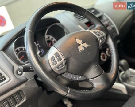 Червоний Міцубісі Аутлендер, об'ємом двигуна 2 л та пробігом 96 тис. км за 10950 $, фото 25 на Automoto.ua
