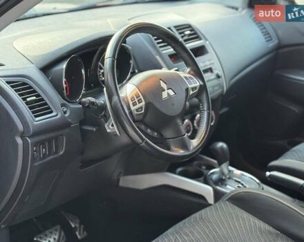Червоний Міцубісі Аутлендер, об'ємом двигуна 2 л та пробігом 96 тис. км за 10950 $, фото 10 на Automoto.ua