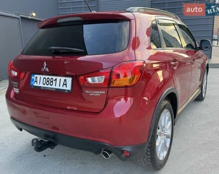 Червоний Міцубісі Аутлендер, об'ємом двигуна 2 л та пробігом 96 тис. км за 10950 $, фото 37 на Automoto.ua