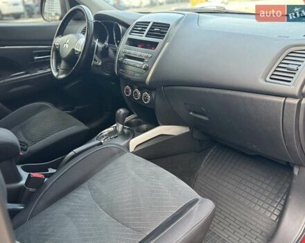 Червоний Міцубісі Аутлендер, об'ємом двигуна 2 л та пробігом 96 тис. км за 10950 $, фото 29 на Automoto.ua