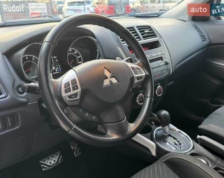 Червоний Міцубісі Аутлендер, об'ємом двигуна 2 л та пробігом 96 тис. км за 10950 $, фото 13 на Automoto.ua