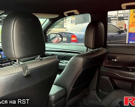 Красный Мицубиси Аутлендер, объемом двигателя 2.4 л и пробегом 209 тыс. км за 13500 $, фото 9 на Automoto.ua