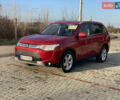 Красный Мицубиси Аутлендер, объемом двигателя 3 л и пробегом 230 тыс. км за 13900 $, фото 2 на Automoto.ua