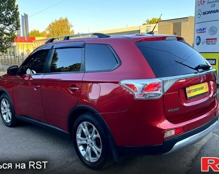 Красный Мицубиси Аутлендер, объемом двигателя 2.4 л и пробегом 209 тыс. км за 12990 $, фото 4 на Automoto.ua