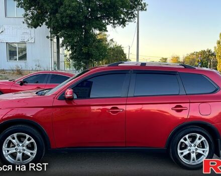 Красный Мицубиси Аутлендер, объемом двигателя 2.4 л и пробегом 209 тыс. км за 12990 $, фото 2 на Automoto.ua