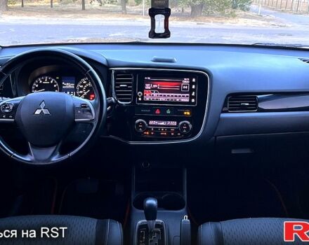 Красный Мицубиси Аутлендер, объемом двигателя 2.4 л и пробегом 209 тыс. км за 12990 $, фото 6 на Automoto.ua