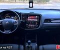 Красный Мицубиси Аутлендер, объемом двигателя 2.4 л и пробегом 209 тыс. км за 12990 $, фото 6 на Automoto.ua