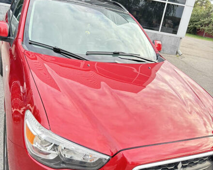 Красный Мицубиси Аутлендер, объемом двигателя 2 л и пробегом 210 тыс. км за 13500 $, фото 2 на Automoto.ua