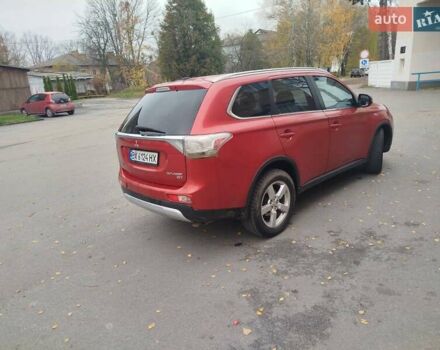 Красный Мицубиси Аутлендер, объемом двигателя 3 л и пробегом 230 тыс. км за 14200 $, фото 5 на Automoto.ua