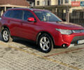 Красный Мицубиси Аутлендер, объемом двигателя 3 л и пробегом 230 тыс. км за 13900 $, фото 1 на Automoto.ua