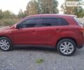 Червоний Міцубісі Аутлендер, об'ємом двигуна 2 л та пробігом 205 тис. км за 10900 $, фото 7 на Automoto.ua