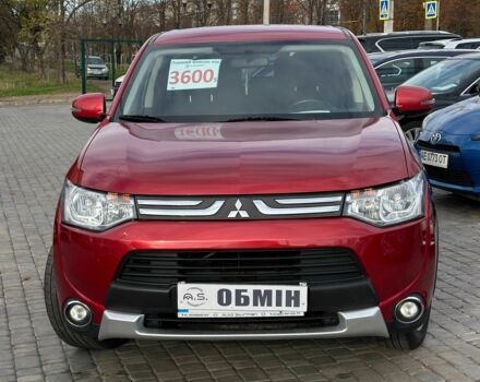 Красный Мицубиси Аутлендер, объемом двигателя 2.4 л и пробегом 213 тыс. км за 11900 $, фото 1 на Automoto.ua