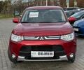 Красный Мицубиси Аутлендер, объемом двигателя 2.4 л и пробегом 213 тыс. км за 11900 $, фото 1 на Automoto.ua