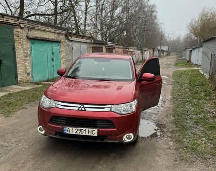 Красный Мицубиси Аутлендер, объемом двигателя 2 л и пробегом 96 тыс. км за 15500 $, фото 1 на Automoto.ua