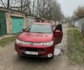 Красный Мицубиси Аутлендер, объемом двигателя 2 л и пробегом 96 тыс. км за 15500 $, фото 1 на Automoto.ua