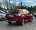 Красный Мицубиси Аутлендер, объемом двигателя 2.4 л и пробегом 213 тыс. км за 11900 $, фото 2 на Automoto.ua