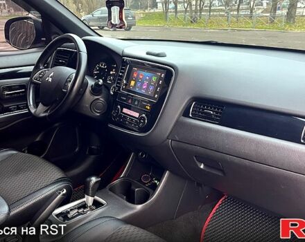 Красный Мицубиси Аутлендер, объемом двигателя 2.4 л и пробегом 209 тыс. км за 13500 $, фото 10 на Automoto.ua