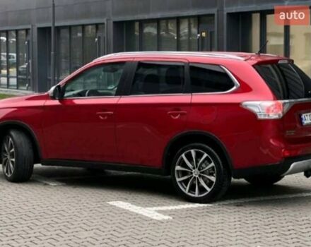 Красный Мицубиси Аутлендер, объемом двигателя 2.2 л и пробегом 225 тыс. км за 14600 $, фото 1 на Automoto.ua