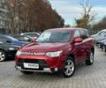 Красный Мицубиси Аутлендер, объемом двигателя 2.4 л и пробегом 213 тыс. км за 11900 $, фото 1 на Automoto.ua
