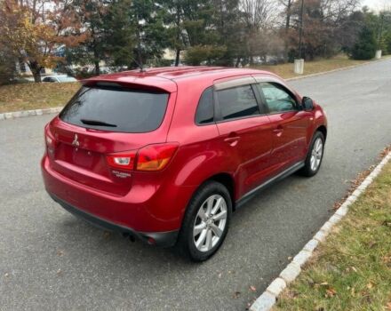 Червоний Міцубісі Аутлендер, об'ємом двигуна 2 л та пробігом 75 тис. км за 9000 $, фото 4 на Automoto.ua