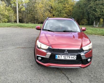 Красный Мицубиси Аутлендер, объемом двигателя 2.4 л и пробегом 185 тыс. км за 12200 $, фото 2 на Automoto.ua