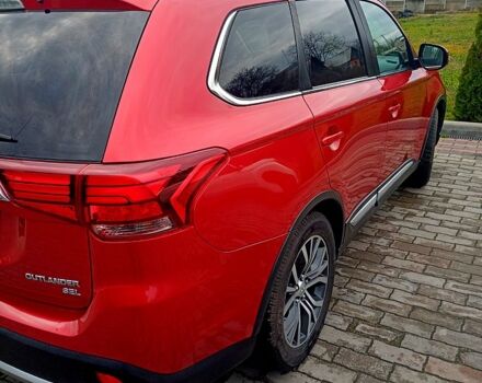 Червоний Міцубісі Аутлендер, об'ємом двигуна 2.4 л та пробігом 131 тис. км за 16300 $, фото 4 на Automoto.ua