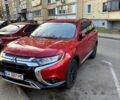 Красный Мицубиси Аутлендер, объемом двигателя 2.4 л и пробегом 134 тыс. км за 13990 $, фото 1 на Automoto.ua