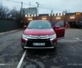 Червоний Міцубісі Аутлендер, об'ємом двигуна 2.4 л та пробігом 117 тис. км за 14000 $, фото 1 на Automoto.ua