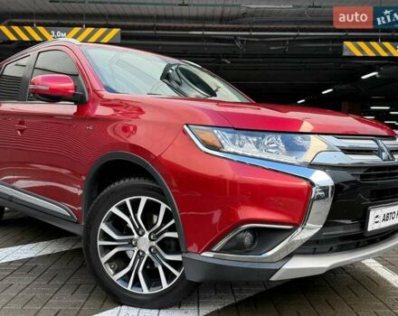 Красный Мицубиси Аутлендер, объемом двигателя 3 л и пробегом 167 тыс. км за 16990 $, фото 1 на Automoto.ua