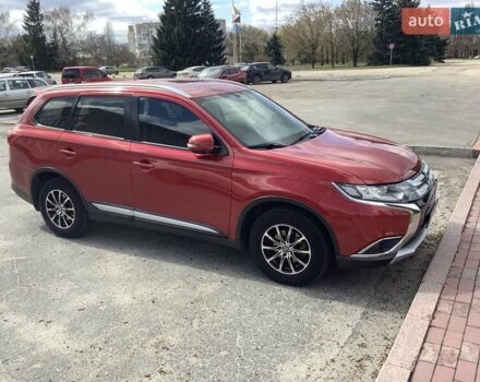 Красный Мицубиси Аутлендер, объемом двигателя 2.4 л и пробегом 90 тыс. км за 19000 $, фото 1 на Automoto.ua