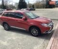 Красный Мицубиси Аутлендер, объемом двигателя 2.4 л и пробегом 90 тыс. км за 19000 $, фото 1 на Automoto.ua