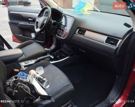 Красный Мицубиси Аутлендер, объемом двигателя 2.36 л и пробегом 118 тыс. км за 14000 $, фото 5 на Automoto.ua