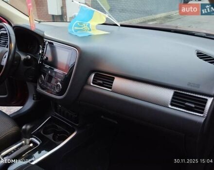 Красный Мицубиси Аутлендер, объемом двигателя 2.36 л и пробегом 118 тыс. км за 14000 $, фото 6 на Automoto.ua