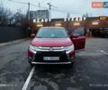 Красный Мицубиси Аутлендер, объемом двигателя 2.36 л и пробегом 118 тыс. км за 14000 $, фото 1 на Automoto.ua