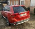 Червоний Міцубісі Аутлендер, об'ємом двигуна 2.4 л та пробігом 188 тис. км за 16000 $, фото 1 на Automoto.ua