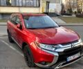 Красный Мицубиси Аутлендер, объемом двигателя 2.4 л и пробегом 134 тыс. км за 13990 $, фото 1 на Automoto.ua