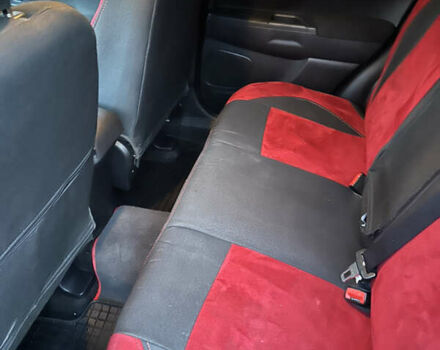 Красный Мицубиси Аутлендер, объемом двигателя 2 л и пробегом 123 тыс. км за 15000 $, фото 1 на Automoto.ua