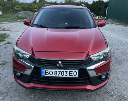 Красный Мицубиси Аутлендер, объемом двигателя 2 л и пробегом 123 тыс. км за 15000 $, фото 3 на Automoto.ua