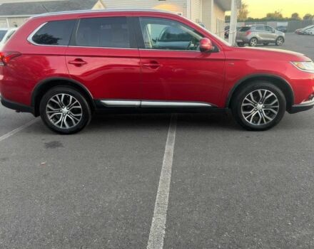 Красный Мицубиси Аутлендер, объемом двигателя 3 л и пробегом 71 тыс. км за 3400 $, фото 1 на Automoto.ua