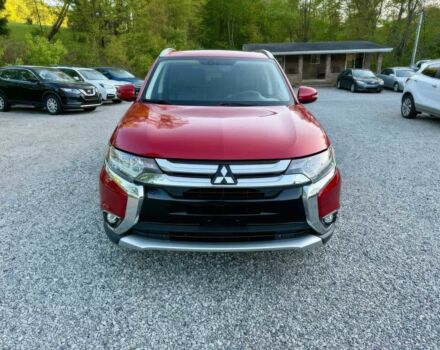 Красный Мицубиси Аутлендер, объемом двигателя 3 л и пробегом 57 тыс. км за 13200 $, фото 1 на Automoto.ua